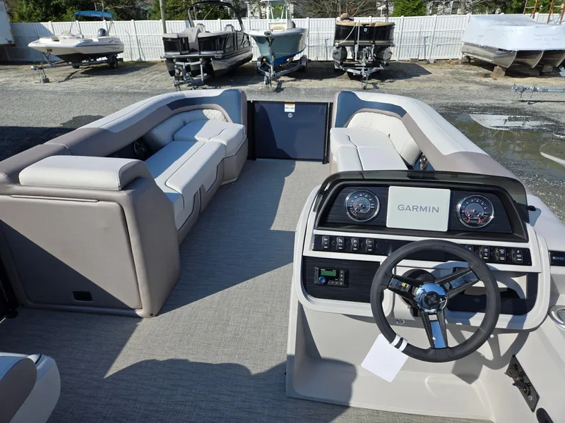 Slide: The Image of 2025 Godfrey SWEETWATER Entertainment 2486 DT pontoon boat interior with Garmin dashboard. - 34