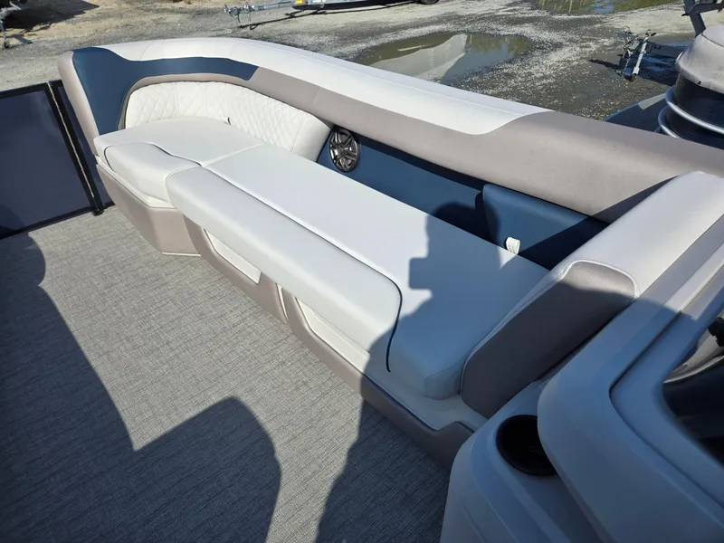 Slide: The Image of 2025 Godfrey SWEETWATER Entertainment 2486 DT boat interior with plush seating. - 38