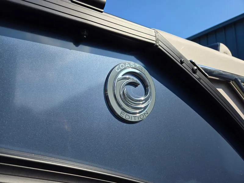 Slide: The Image of 2025 Godfrey SWEETWATER Entertainment 2486 DT, Coast Edition emblem on sleek blue exterior. - 42