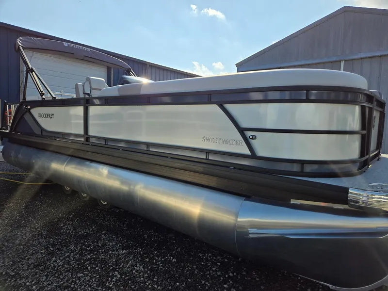 Slide: The Image of 2025 Godfrey SWEETWATER Entertainment 2486 DT pontoon boat in storage yard. - 7