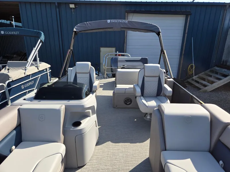Slide: The Image of 2025 Godfrey SWEETWATER Entertainment 2486 DT pontoon boat with spacious seating and modern design. - 9
