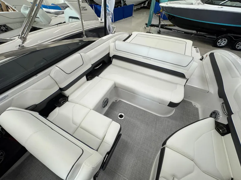 Slide: The Image of 2025 Formula 240 BR boat interior with white seating and modern design. - 10