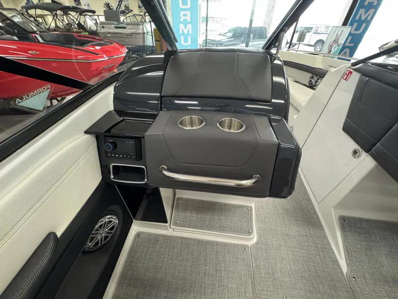 Slide: The Image of 2025 Formula 240 BR boat interior with cup holders and sleek seating design. - 12