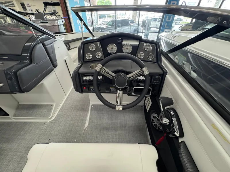 Slide: The Image of 2025 Formula 240 BR boat cockpit with modern steering and instrument panel. - 14