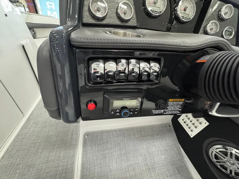Slide: The Image of Control panel of 2025 Formula 240 BR boat with switches and gauges. - 16