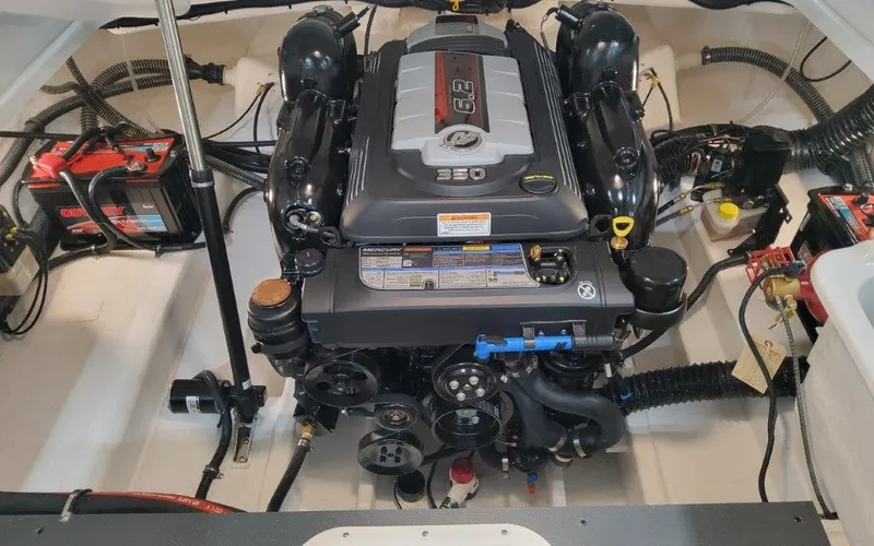Slide: The Image of Engine compartment of a 2025 Formula 240 BR boat, featuring a powerful 350 engine. - 18