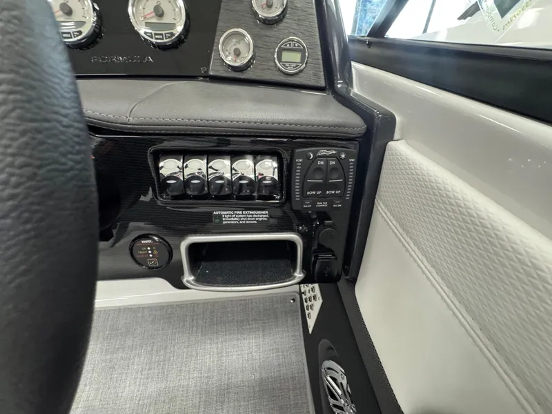 Slide: The Image of 2025 Formula 240 BR dashboard with control panel and gauges. - 19