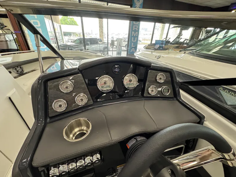 Slide: The Image of Dashboard of 2025 Formula 240 BR boat with gauges and steering wheel. - 21