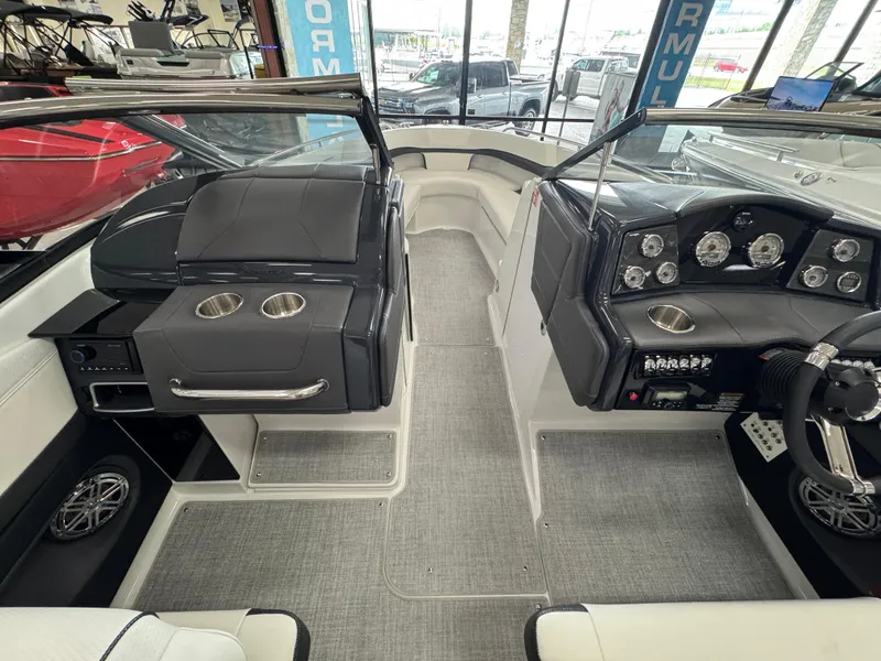 Slide: The Image of Interior view of 2025 Formula 240 BR boat, featuring sleek dashboard and seating. - 22