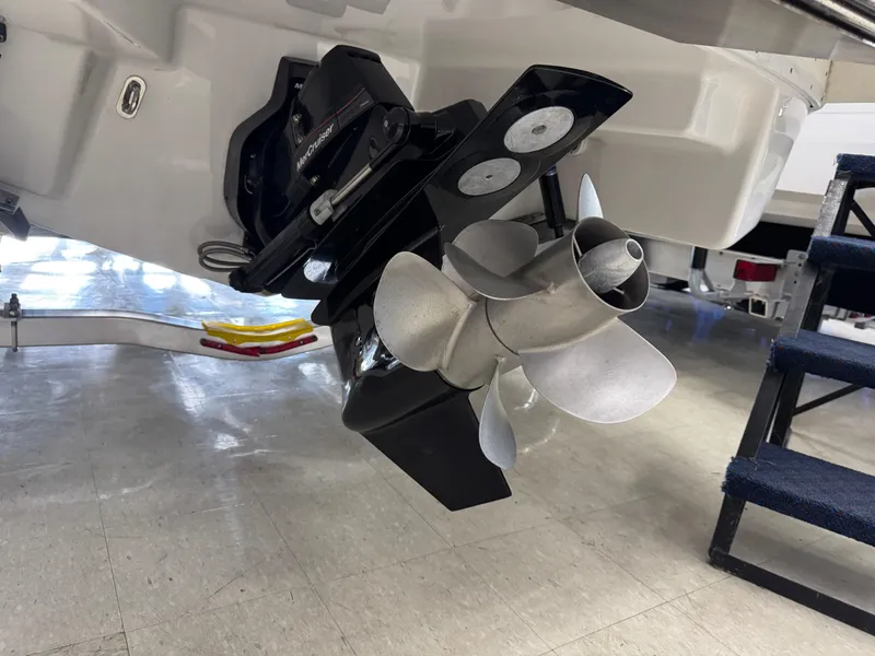 Slide: The Image of 2025 Formula 240 BR boat propeller and stern drive in a showroom setting. - 4