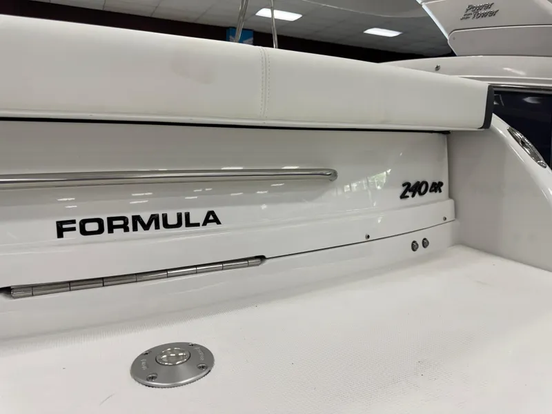 Slide: The Image of 2025 Formula 240 BR boat, sleek white design with branding details. - 6