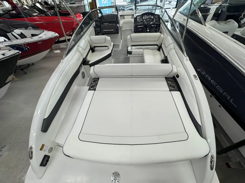Slide: The Image of 2025 Formula 240 BR boat interior with white seating and sleek design. - 7