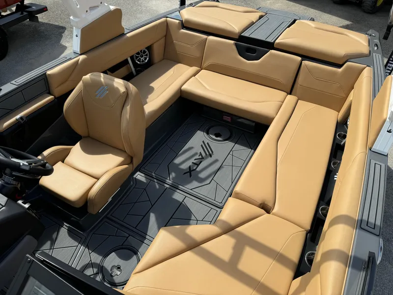 Slide: The Image of 2025 ATX Surf Boats 22 Type-S interior with tan seating and modern design. - 10