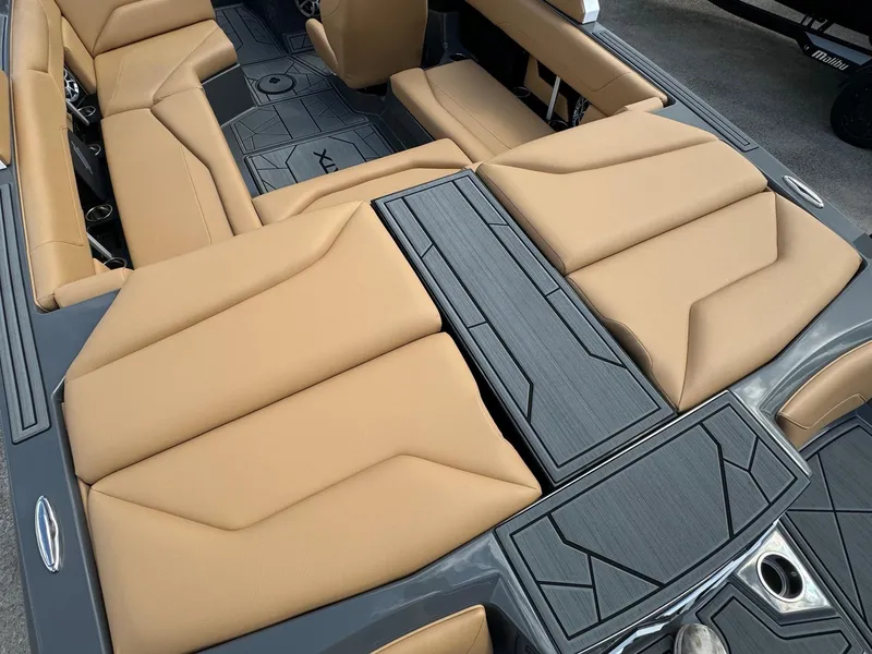 Slide: The Image of 2025 ATX Surf Boats 22 Type-S interior with tan seating and sleek design. - 12