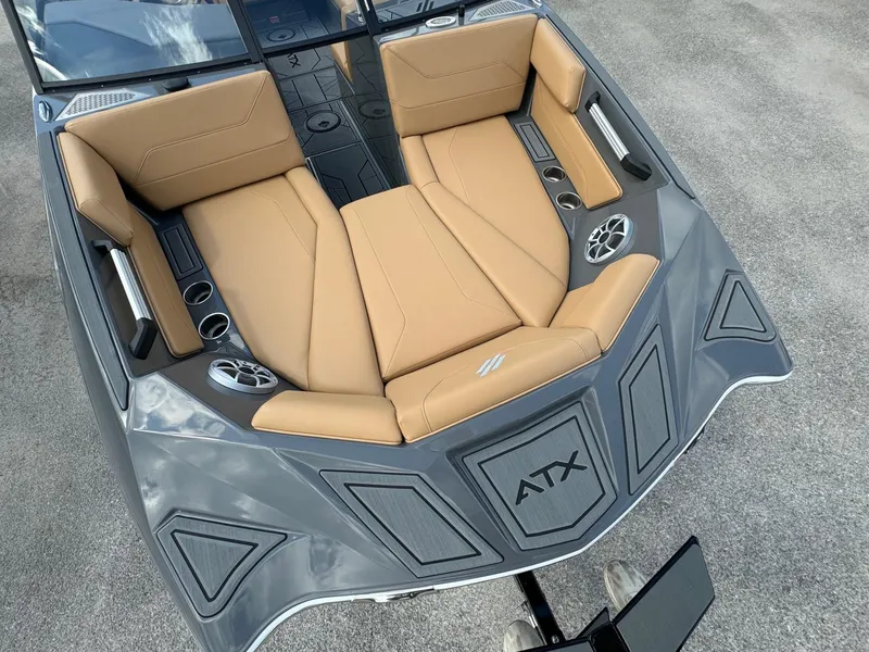 Slide: The Image of 2025 ATX Surf Boats 22 Type-S with tan seating and sleek gray design. - 5