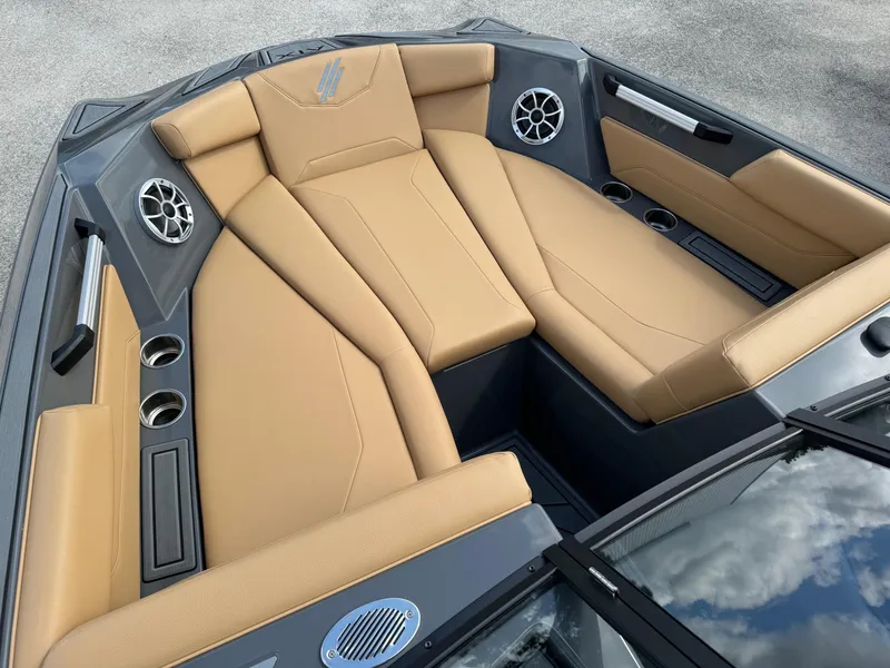 Slide: The Image of 2025 ATX Surf Boats 22 Type-S interior with tan seating and modern design. - 6
