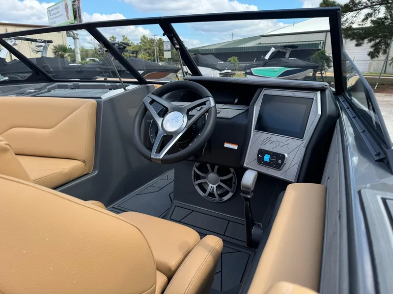 Slide: The Image of 2025 ATX Surf Boats 22 Type-S interior with tan seats and modern dashboard. - 8
