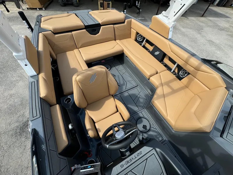Slide: The Image of 2025 ATX Surf Boats 22 Type-S interior with tan leather seating and modern design. - 9