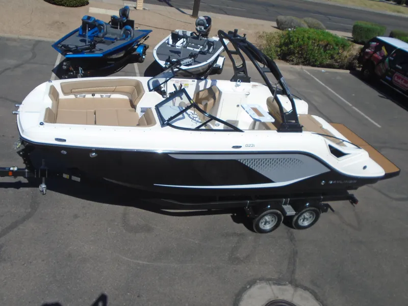 Slide: The Image of 2025 Bayliner D22I boat on trailer in parking lot, side view. - 18
