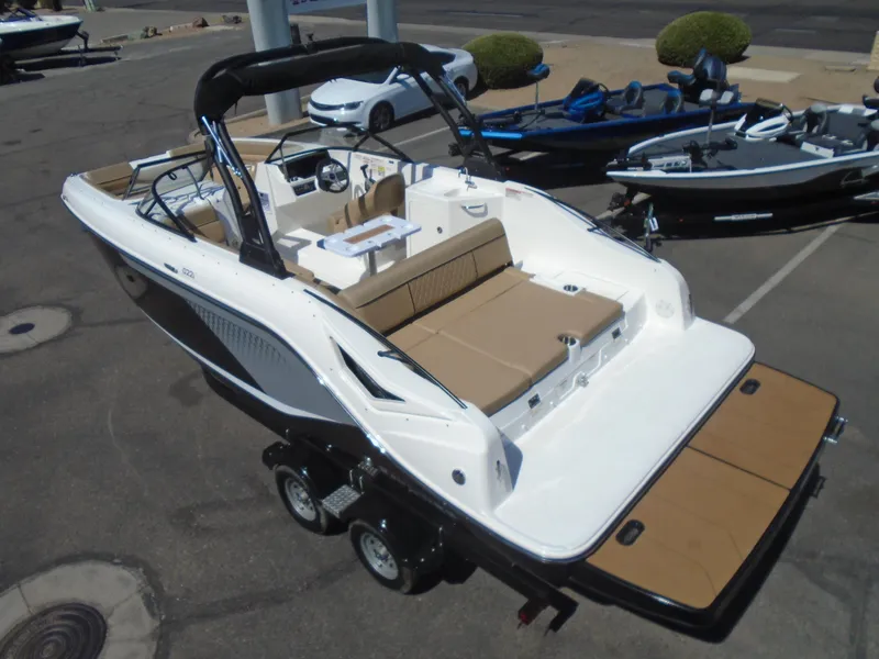 Slide: The Image of 2025 Bayliner D22I boat on trailer, featuring spacious seating and sleek design. - 19