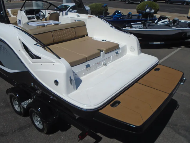 Slide: The Image of 2025 Bayliner D22I boat with spacious seating and sleek design on a trailer. - 7