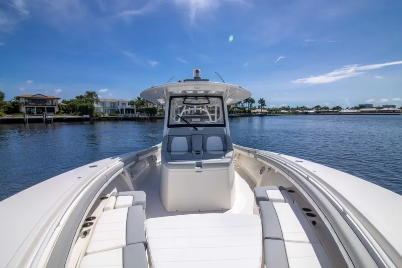 Slide: The Image of 2021 Regulator 41 boat on calm water under clear blue sky. - 13