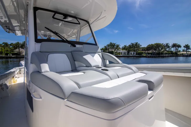 Slide: The Image of Luxurious seating on 2021 Regulator 41 boat, with scenic waterfront view. - 15
