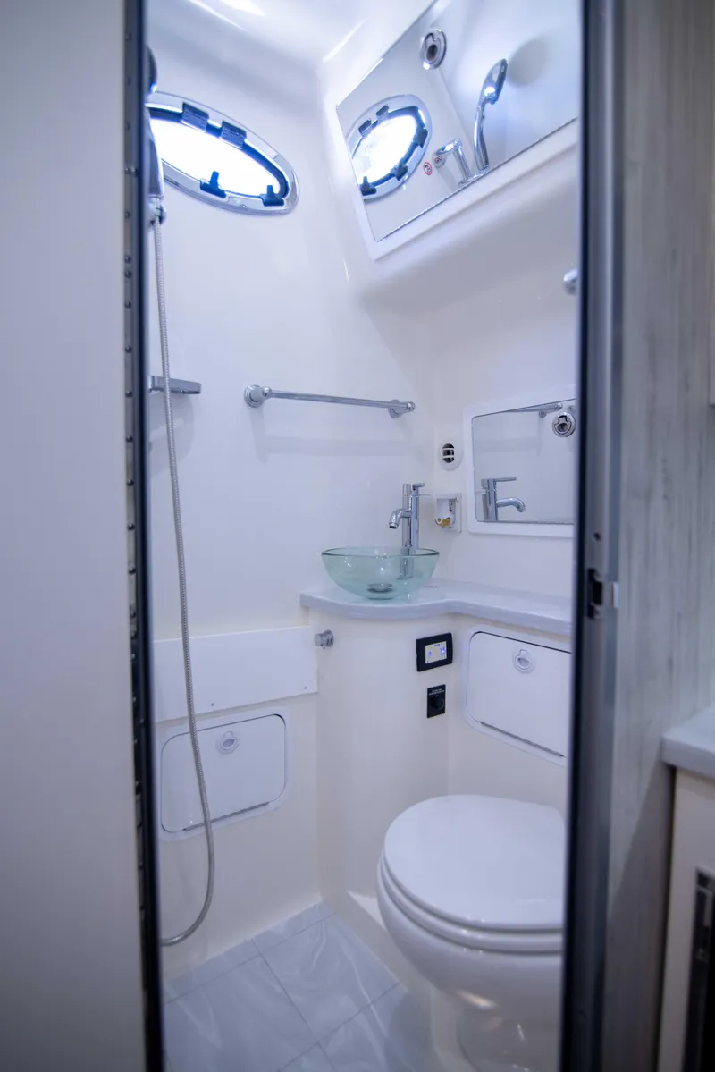 Slide: The Image of 2021 Regulator 41 boat bathroom with modern fixtures and compact design. - 25