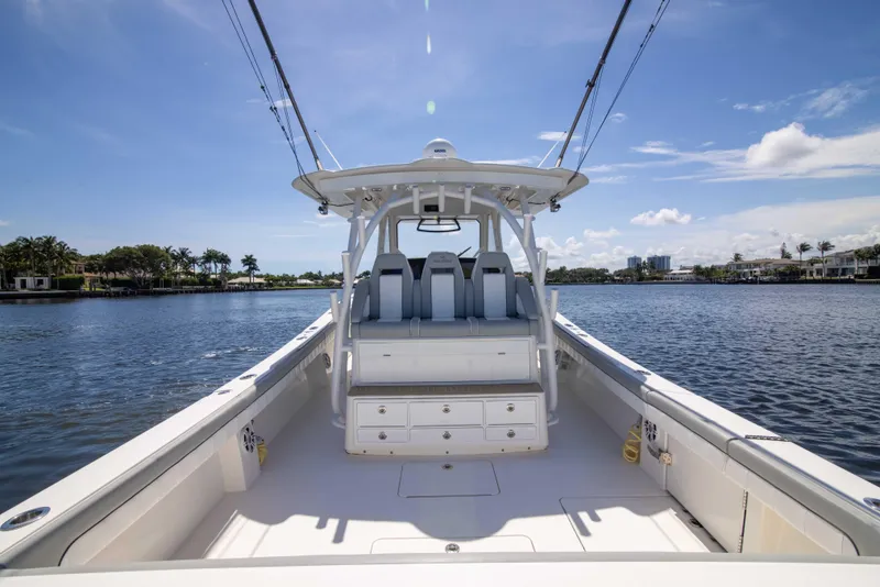 Slide: The Image of 2021 Regulator 41 boat on calm water under clear blue sky. - 27