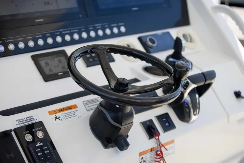 Slide: The Image of Steering wheel and controls of 2021 Regulator 41 boat. - 3