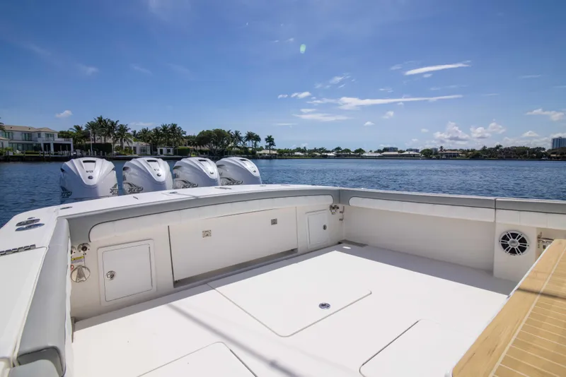Slide: The Image of 2021 Regulator 41 boat with spacious deck and quad engines on a sunny day. - 32
