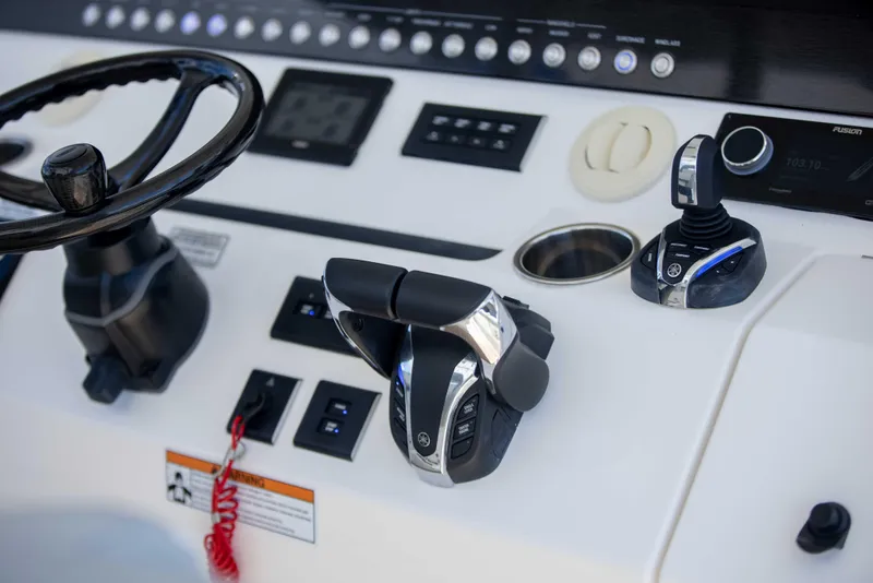 Slide: The Image of 2021 Regulator 41 boat helm with steering wheel and controls. - 4
