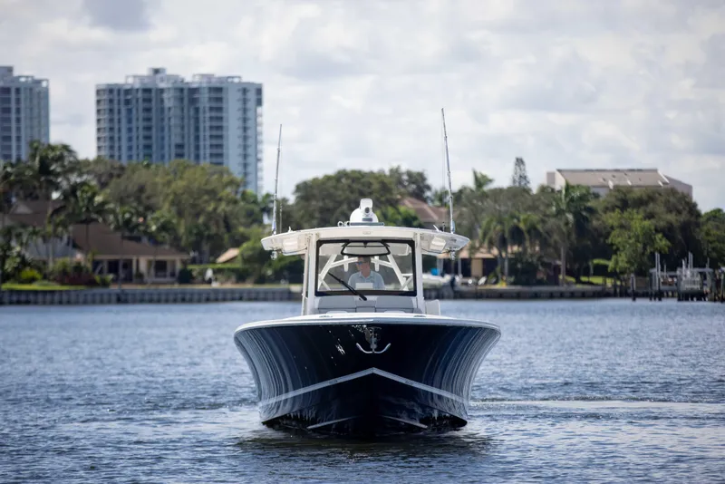 Slide: The Image of 2021 Regulator 41 boat on water with cityscape background. - 40