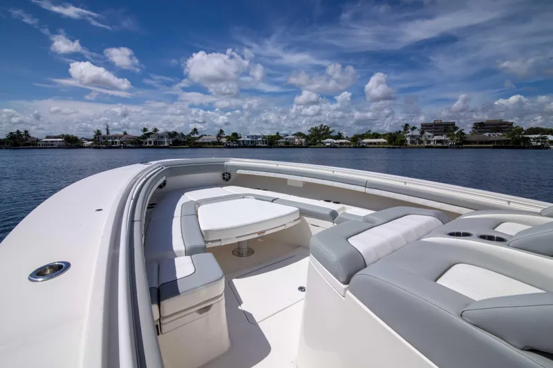 Slide: The Image of 2021 Regulator 41 boat with spacious seating on a sunny day. - 8