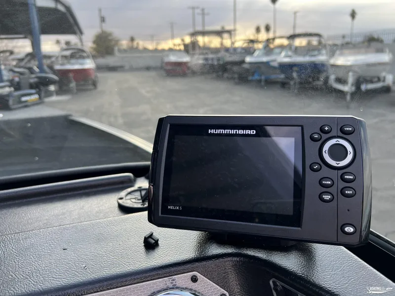 Slide: The Image of Humminbird Helix 5 fish finder on Lund 1675 Adventure Sport 2025 dashboard. - 10