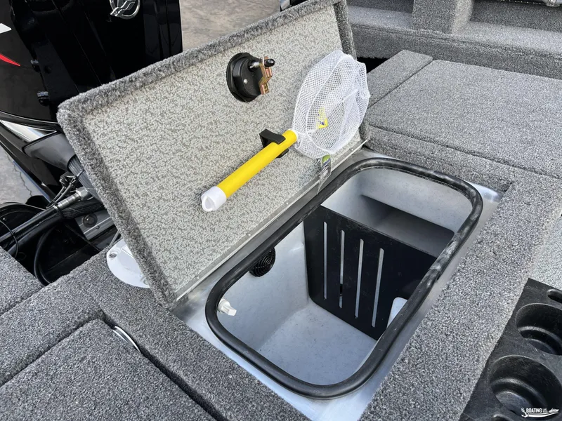 Slide: The Image of 2025 Lund 1675 Adventure Sport boat storage compartment with net and key switch. - 18