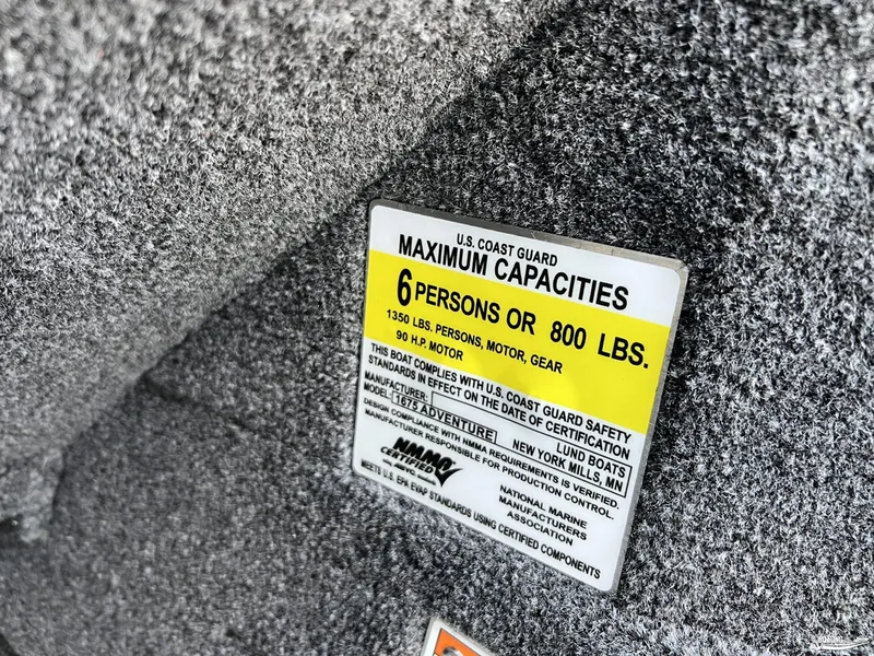 Slide: The Image of Capacity label on 2025 Lund 1675 Adventure Sport boat, indicating 6 persons or 800 lbs. - 21