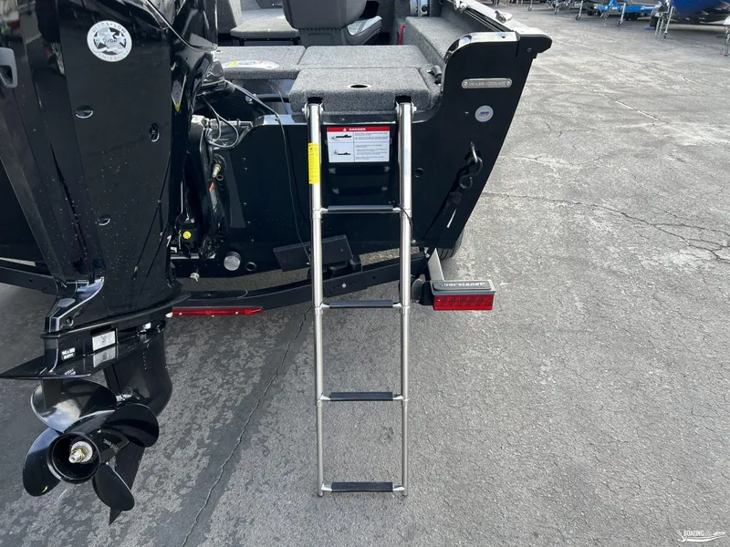 Slide: The Image of 2025 Lund 1675 Adventure Sport boat with ladder and motor, rear view. - 4