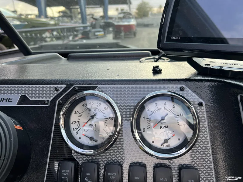 Slide: The Image of Dashboard of 2025 Lund 1675 Adventure Sport boat with gauges and controls. - 8