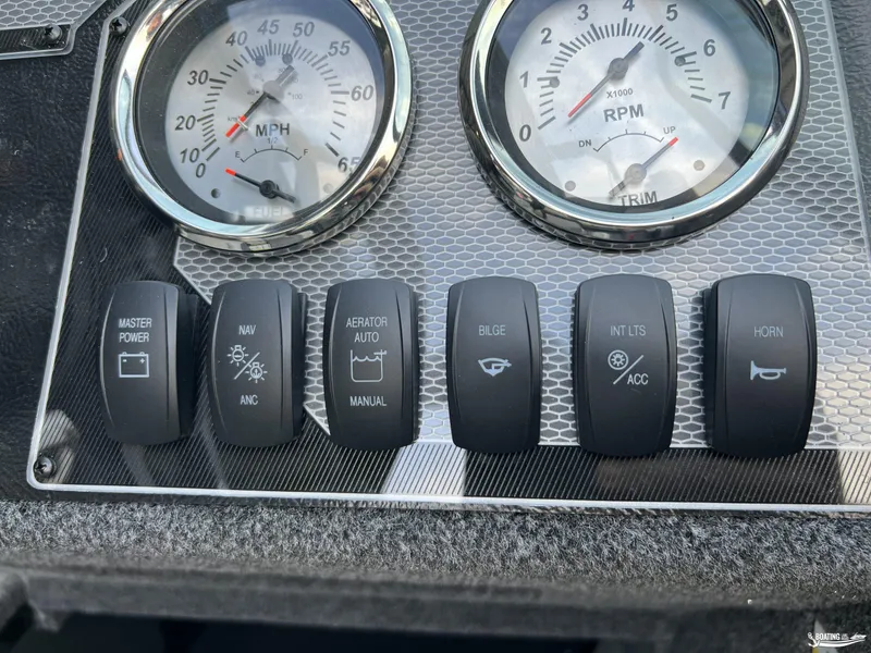 Slide: The Image of Dashboard of 2025 Lund 1675 Adventure Sport with gauges and control switches. - 9