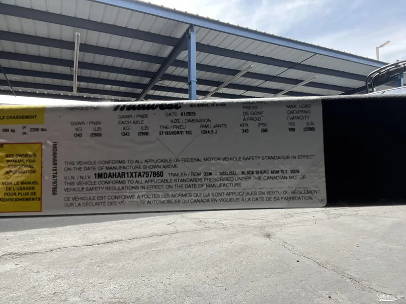 Slide: The Image of Label on 2025 Lund 1650 Rebel XL Blackout Package, showing specifications and compliance details. - 14