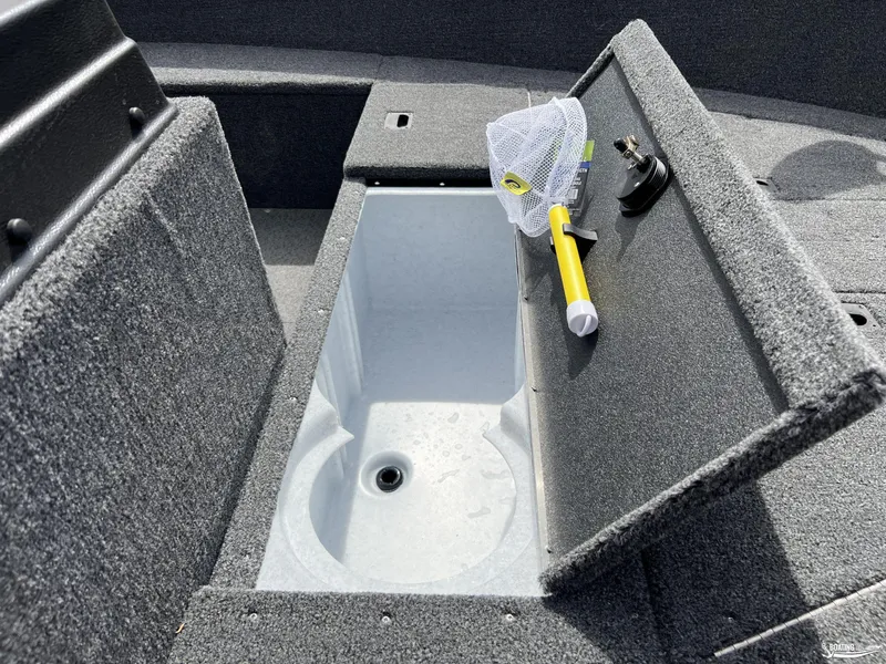 Slide: The Image of Open storage compartment in 2025 Lund 1650 Rebel XL Blackout Package boat. - 5