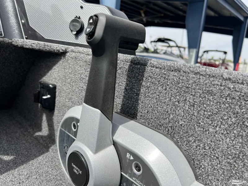 Slide: The Image of Close-up of throttle control in 2025 Lund 1650 Rebel XL Blackout Package boat. - 9