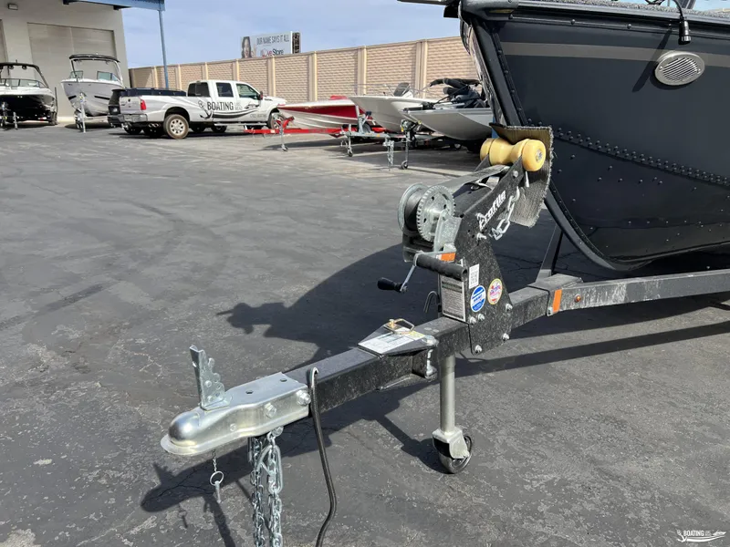 Slide: The Image of 2025 Lund 1650 Angler Sport boat on trailer in dealership lot. - 13