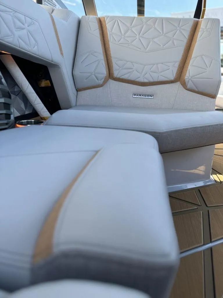 Slide: The Image of 2025 Nautique Paragon 25 interior seating with elegant design and premium materials. - 14