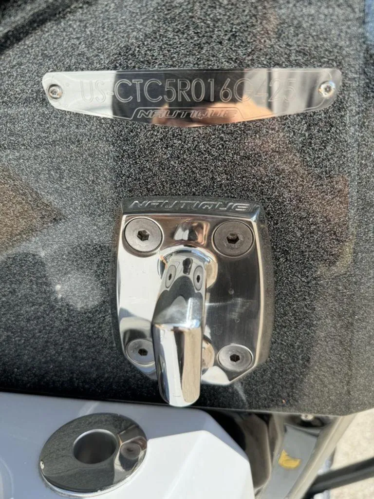 Slide: The Image of Close-up of 2025 Nautique Paragon 25 boat hardware and identification plate. - 22