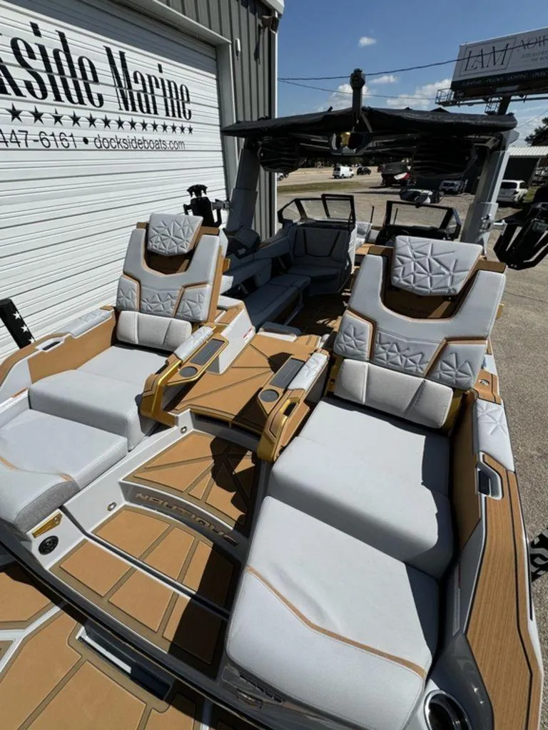 Slide: The Image of 2025 Nautique Paragon 25 boat interior with luxurious seating at Dockside Marine. - 8