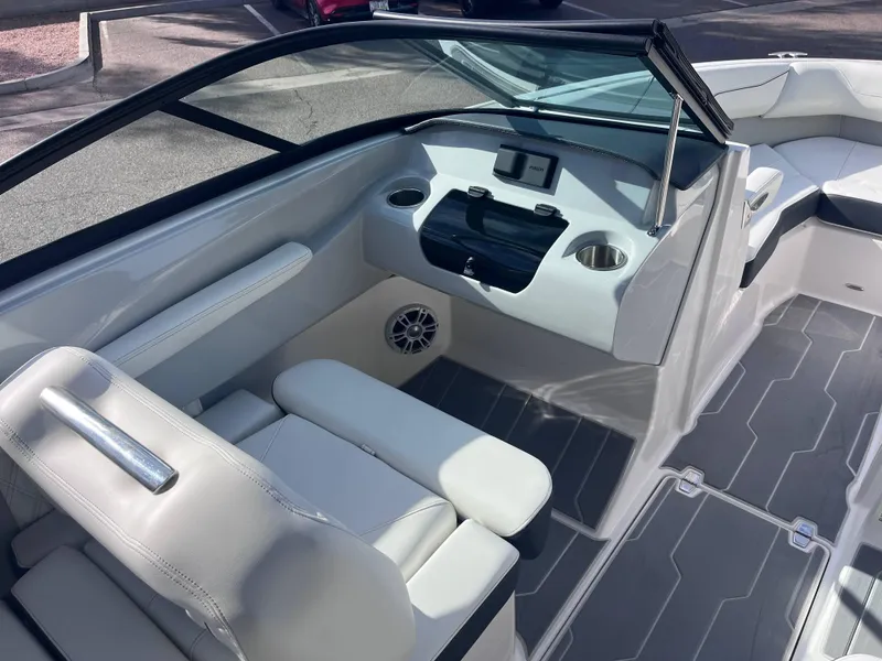 Slide: The Image of 2022 Regal LS2-CM boat interior with sleek seating and modern dashboard. - 8