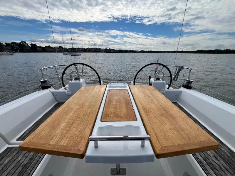 Slide: The Image of Cockpit view of 2018 Beneteau Oceanis 35.1 sailboat with dual steering wheels on calm water. - 14