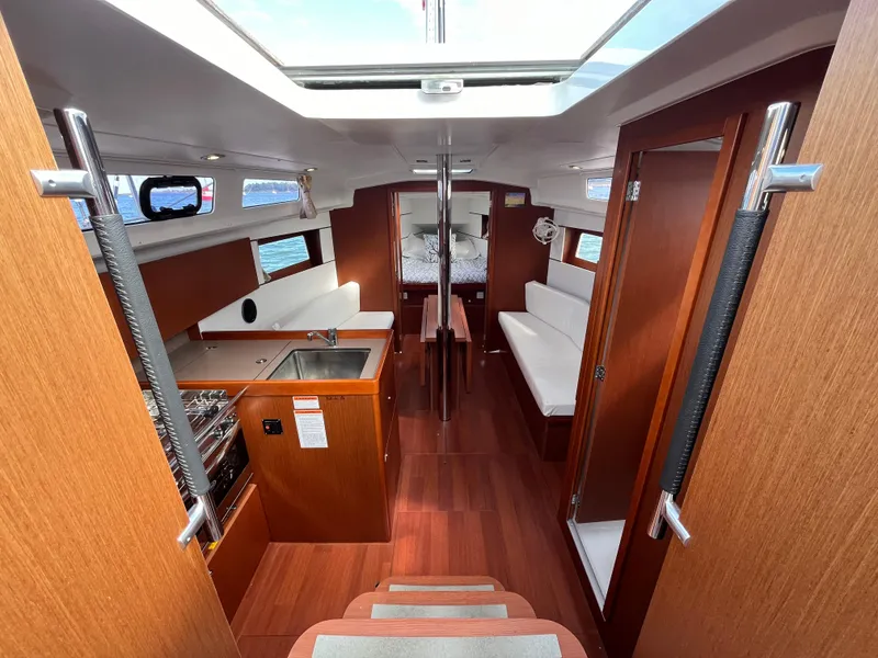 Slide: The Image of Interior of 2018 Beneteau Oceanis 35.1 sailboat with wood finish and modern design. - 25